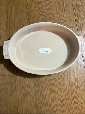 Le Creuset sky blue Oval Stoneware Casserole Dish with Handles
